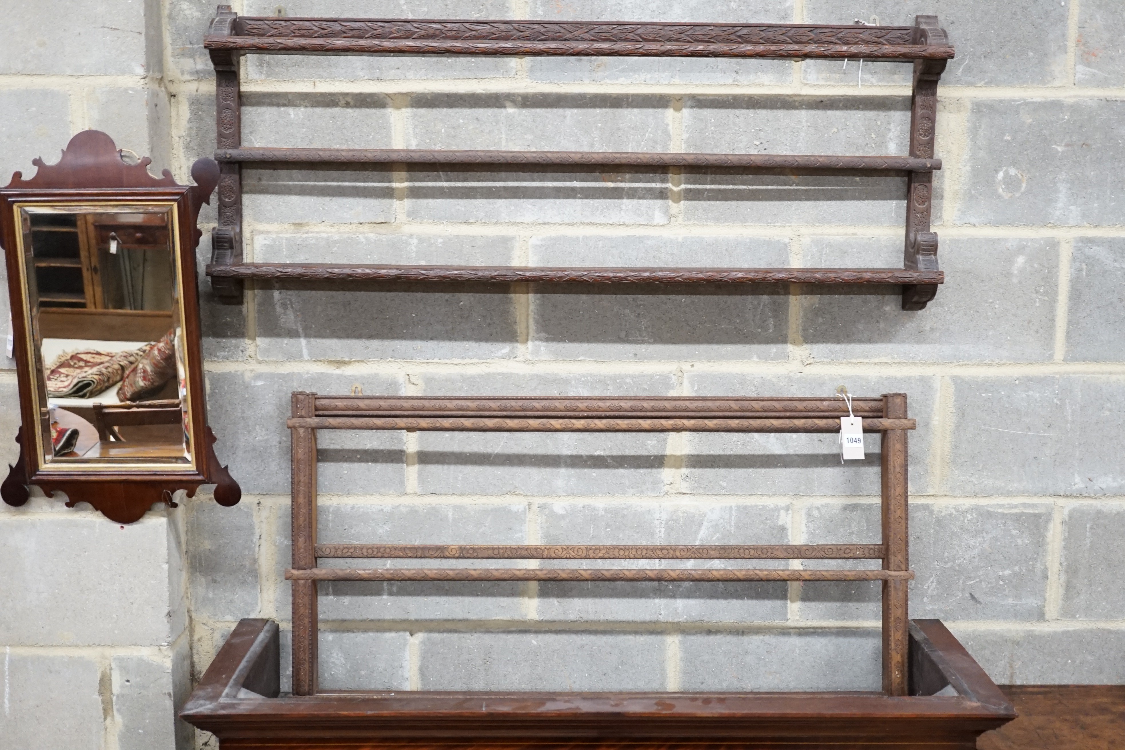 Two Continental carved beech plate racks, length 120cm, height 105cm
